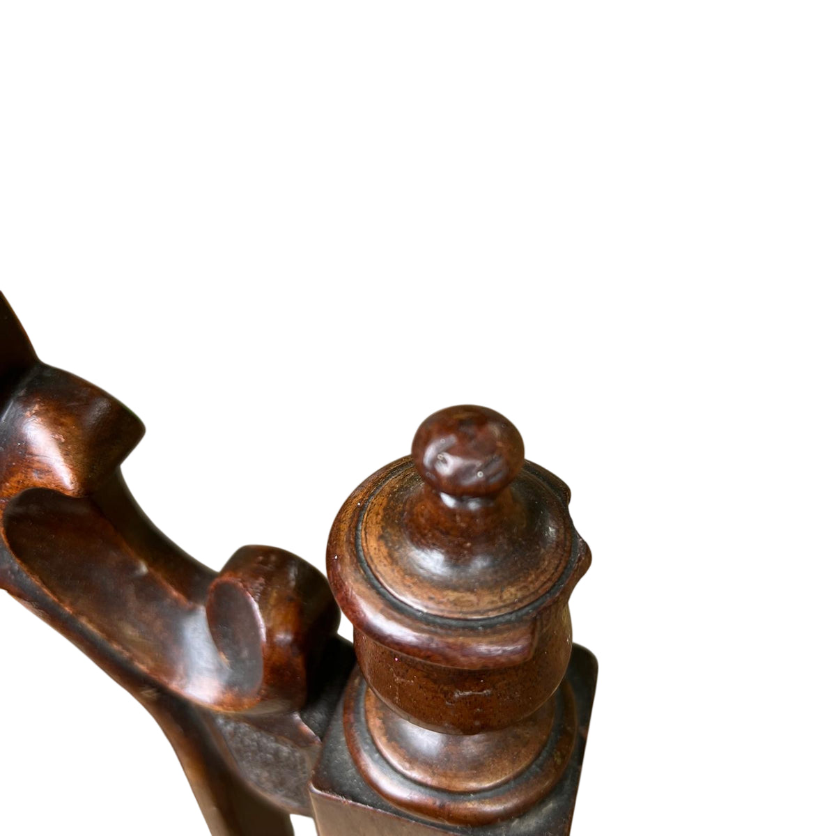 Top crest carving with floral motif and incised detailing