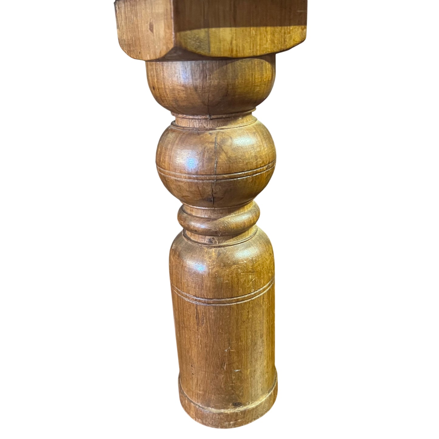 Wooden side table top showing natural grain and patina with bolt details