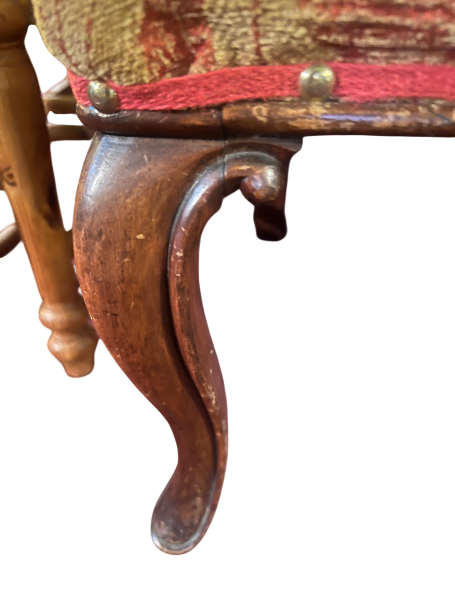 Wear and finish patina on barley-twist column and carved splat of Victorian chair