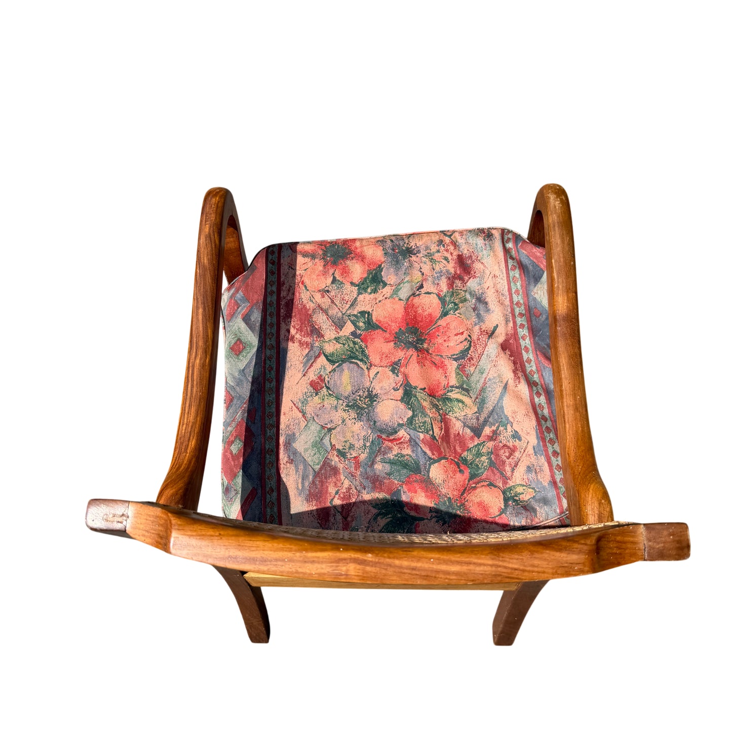 Overall view of vintage wooden armchair showing cane back and seat