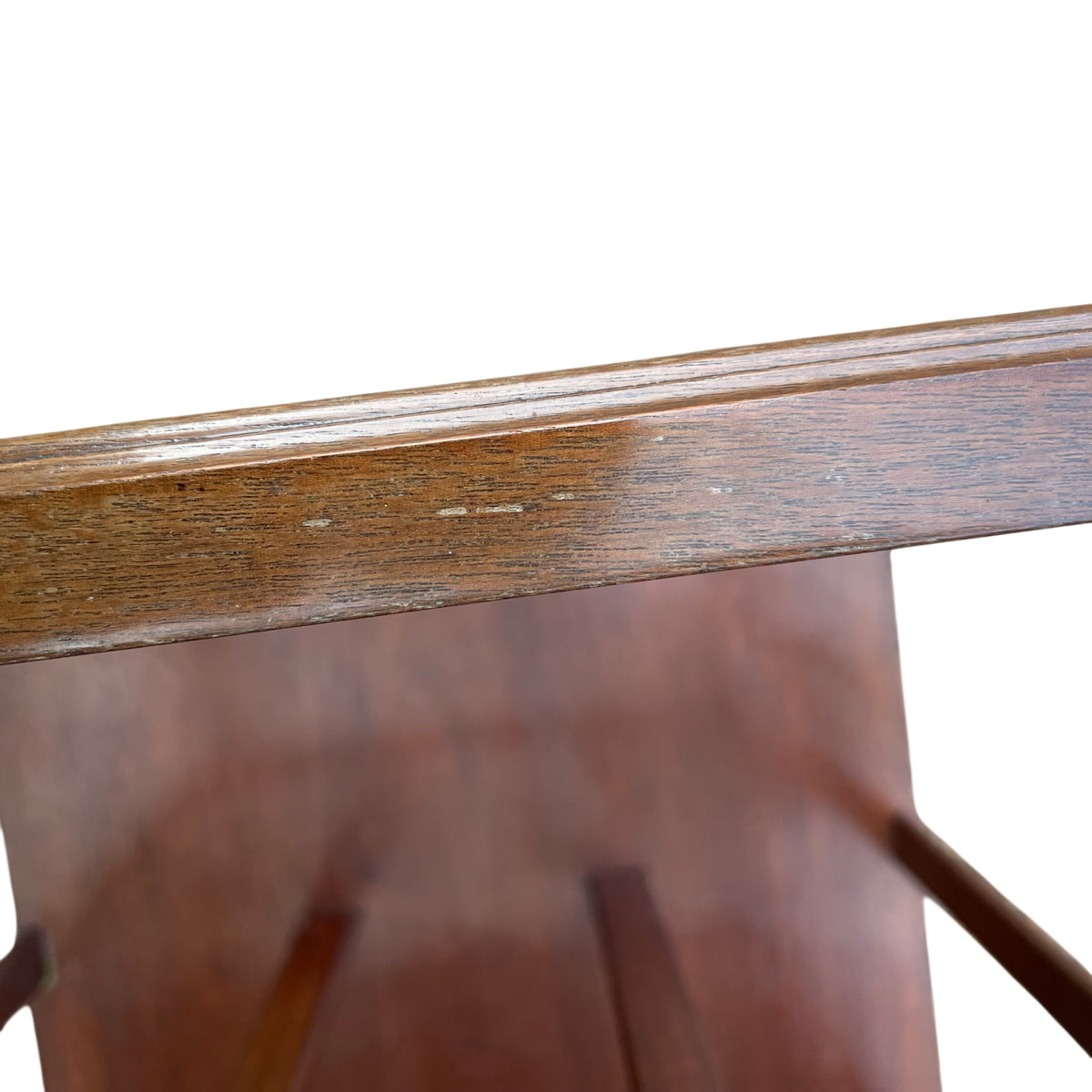 Drawer detail with metal drop handles on vintage wooden magazine rack