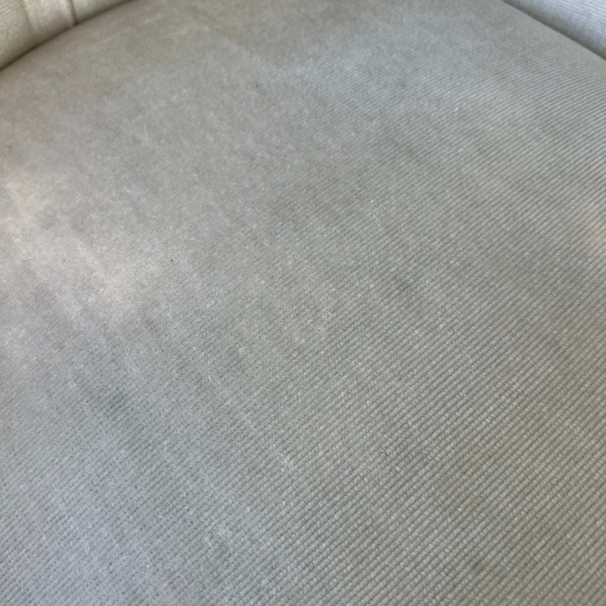 Shaped wood armrail and trim on upholstered Victorian armchair