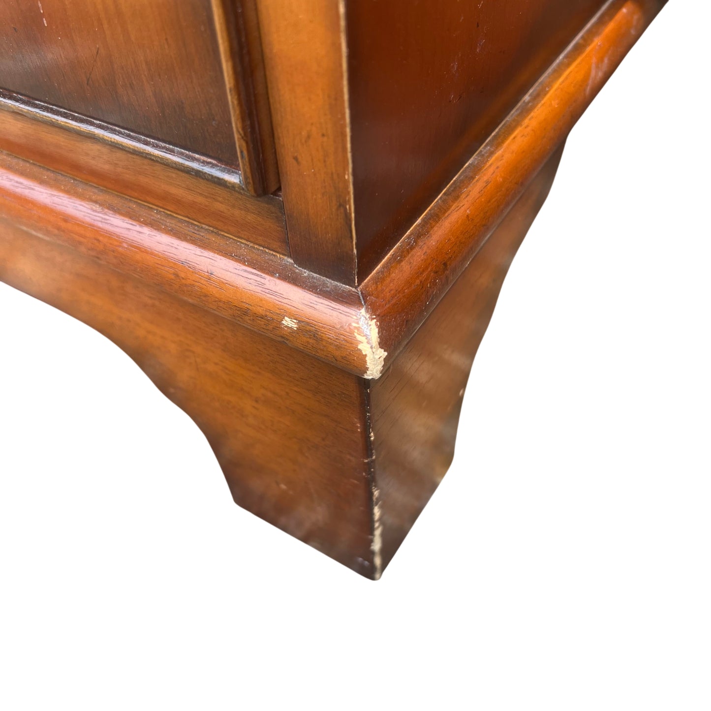 Close view of drawer fronts showing grain and finish of wooden desk