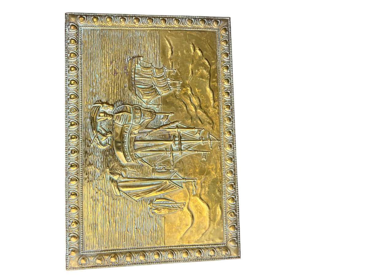 Rear corner of vintage brass storage box with hammered metal surface