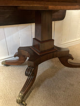 Load image into Gallery viewer, Antique Mahogany Drop Leaf Table On Pedestal With A Drawer Brass Castors
