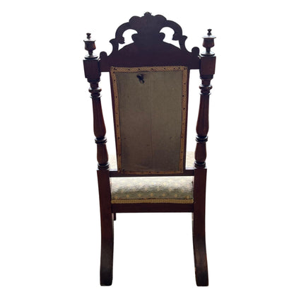 Turned front leg and carved apron on a Victorian dining chair
