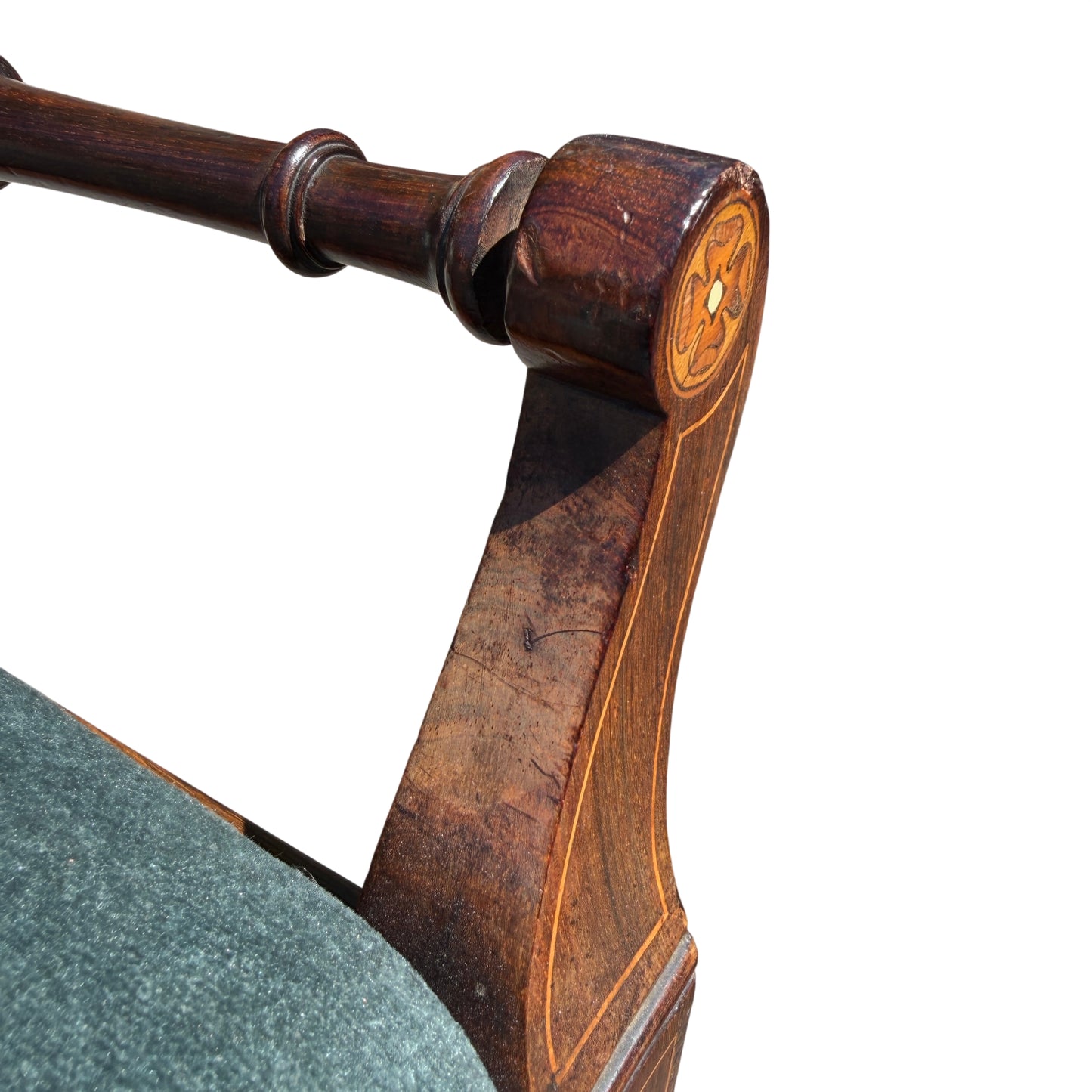Close-up of upholstered seat edge with decorative studs on lift-up piano stool