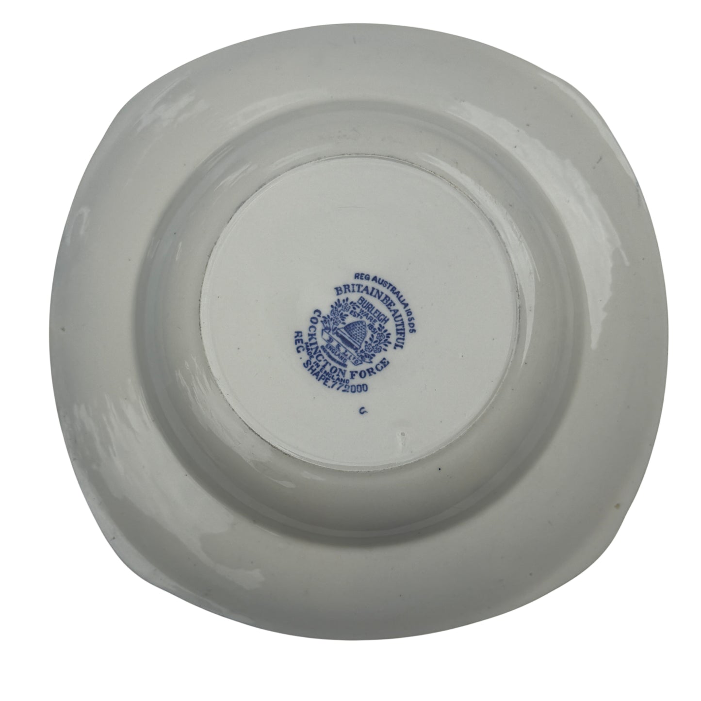 Close-up of gilt rim and leaf border on a Burleigh Ware blue and white bowl