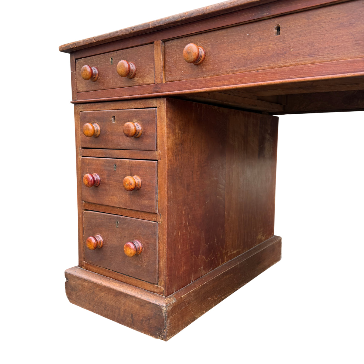 Side profile of pedestal desk showing plinth base and pedestal construction
