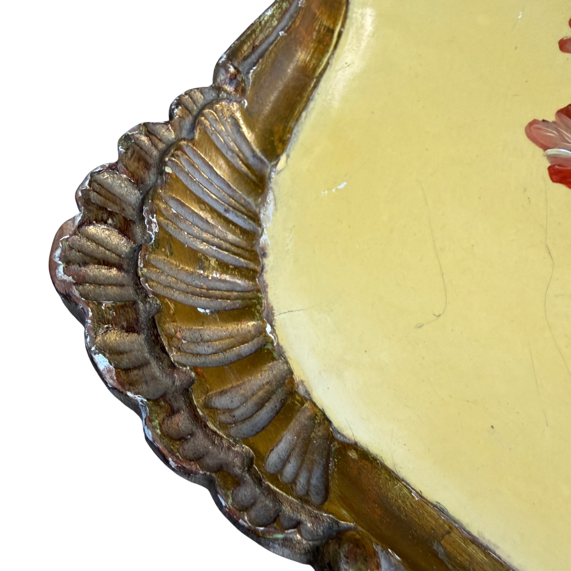 Edge view showing gilt moulding and painted yellow surface of tray