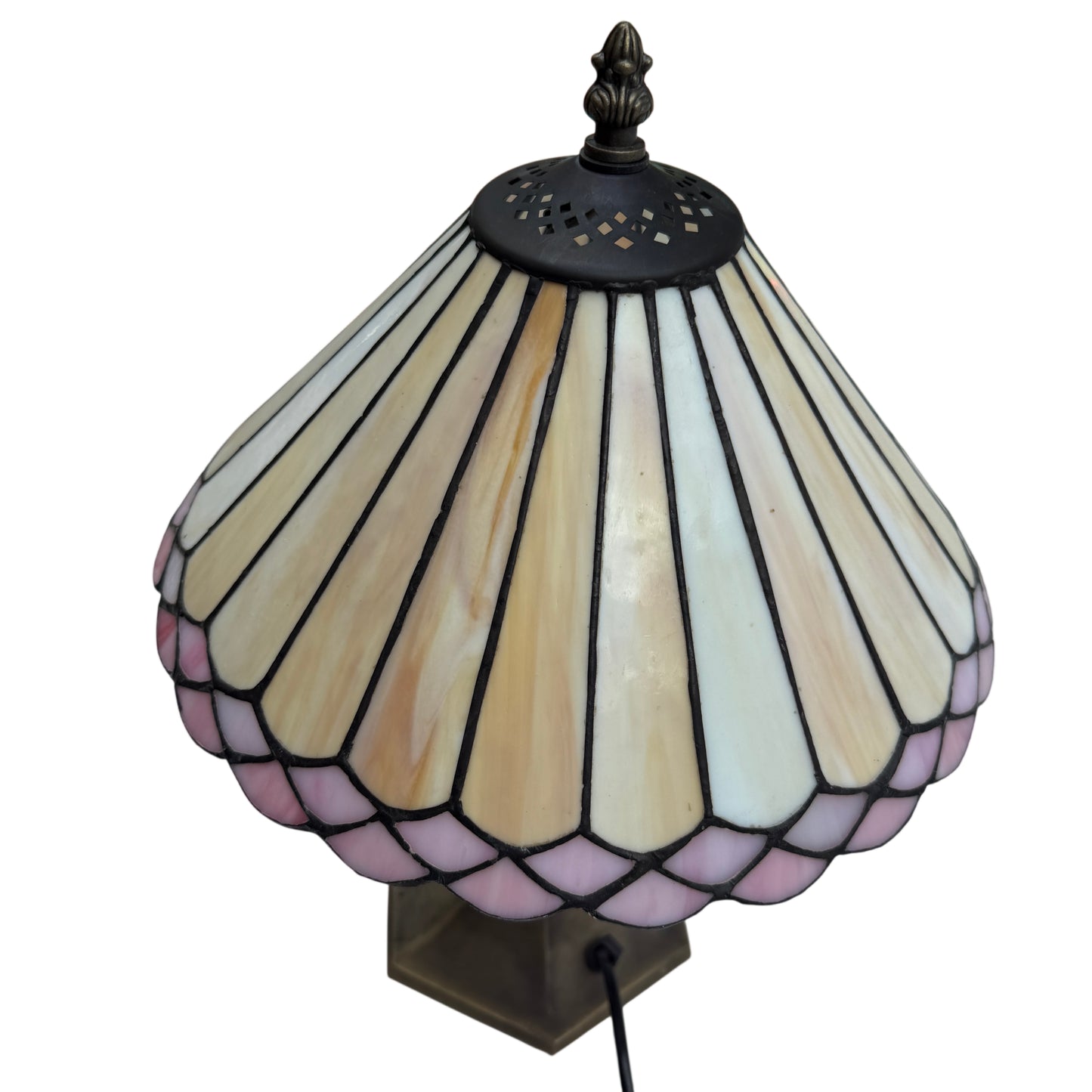 Edge detail of stained glass shade with alternating cream and pale pink segments