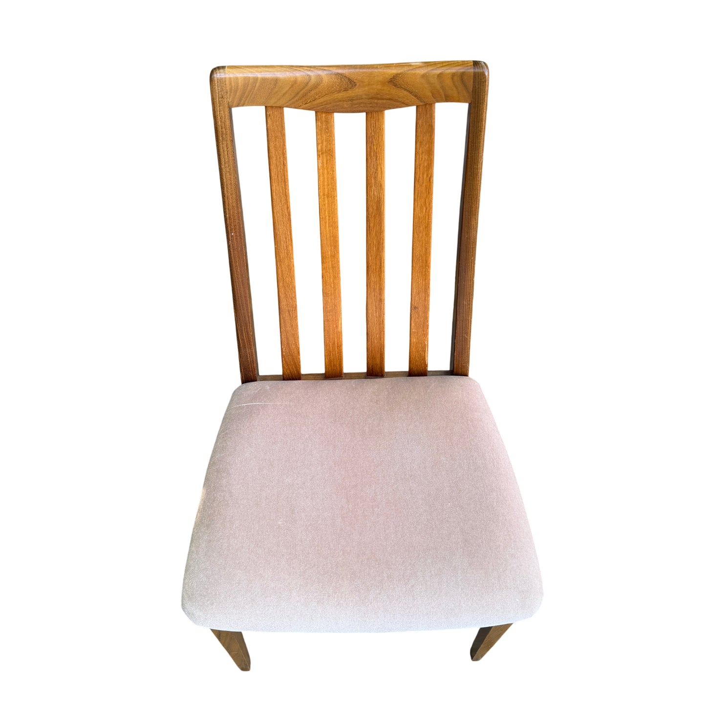 Front view of four vintage dining chairs with pale upholstered seats and wood frames
