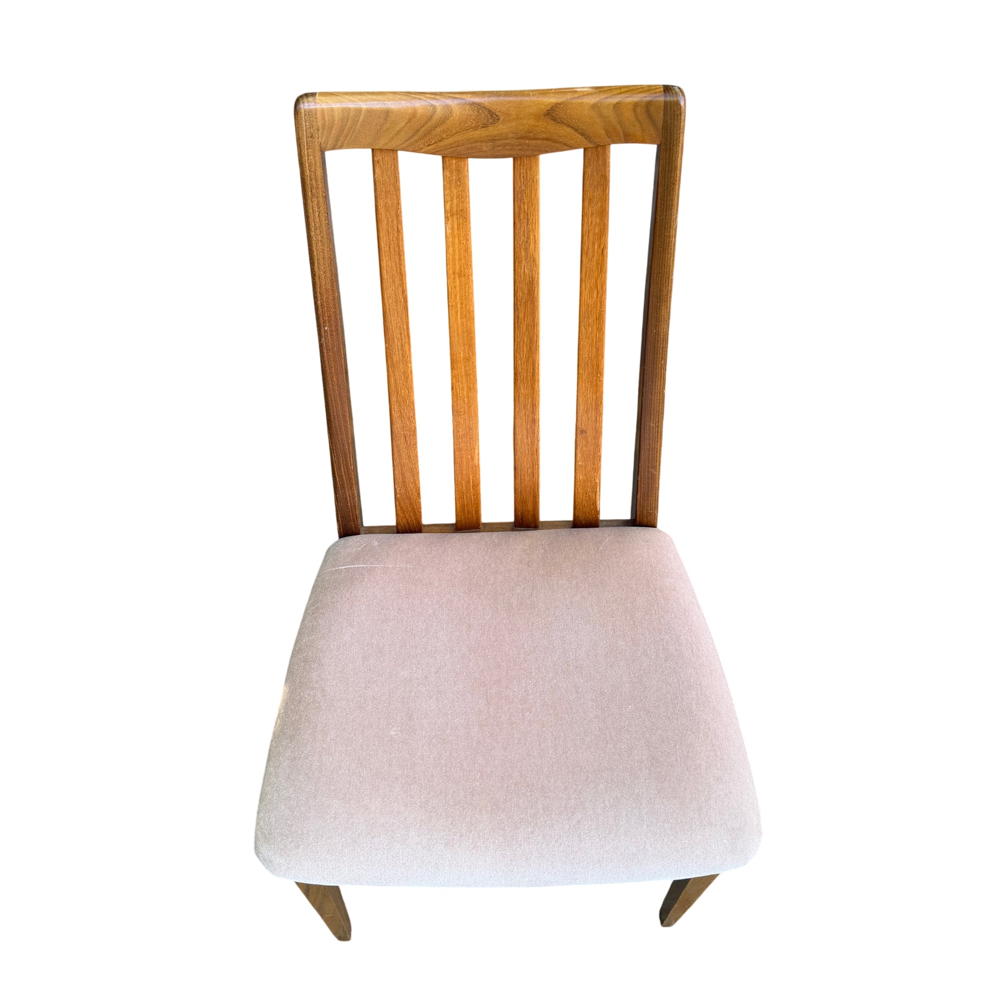Front view of four vintage dining chairs with pale upholstered seats and wood frames