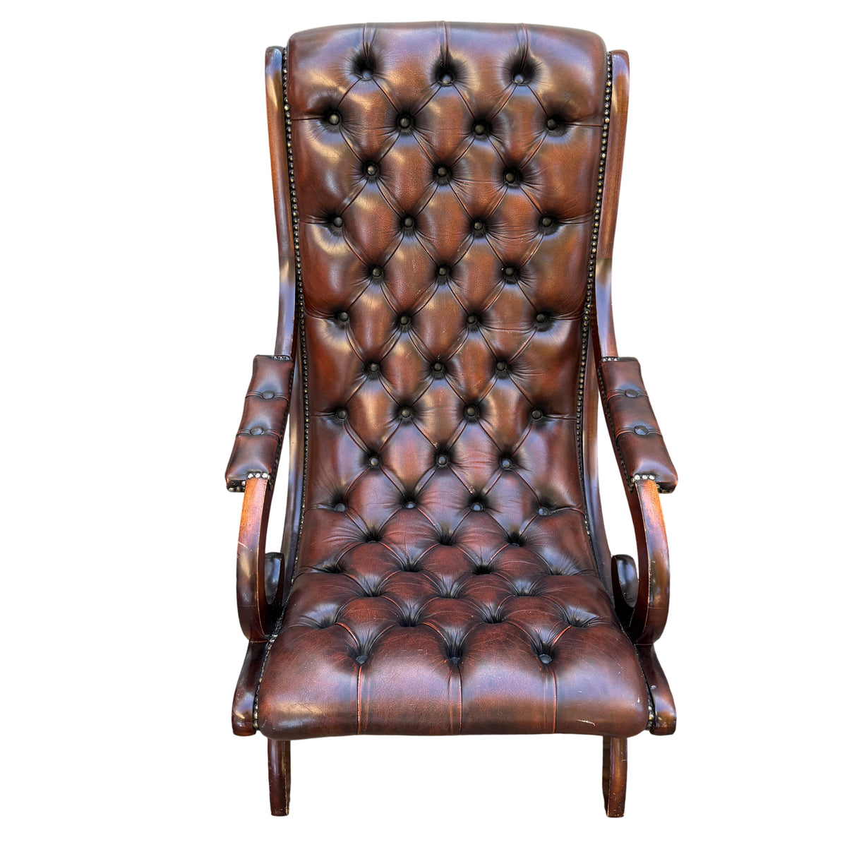 Deep-buttoned brown leather Chesterfield-style armchair with brass studs