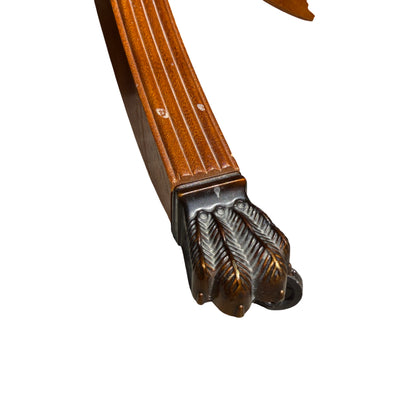 Side view of vintage pedestal table showing turned column and underside construction