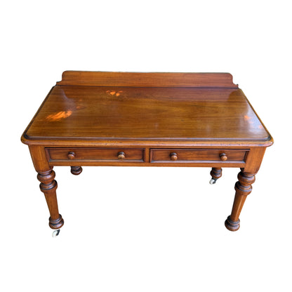 Close-up of turned spindle leg and original ceramic castor on console table