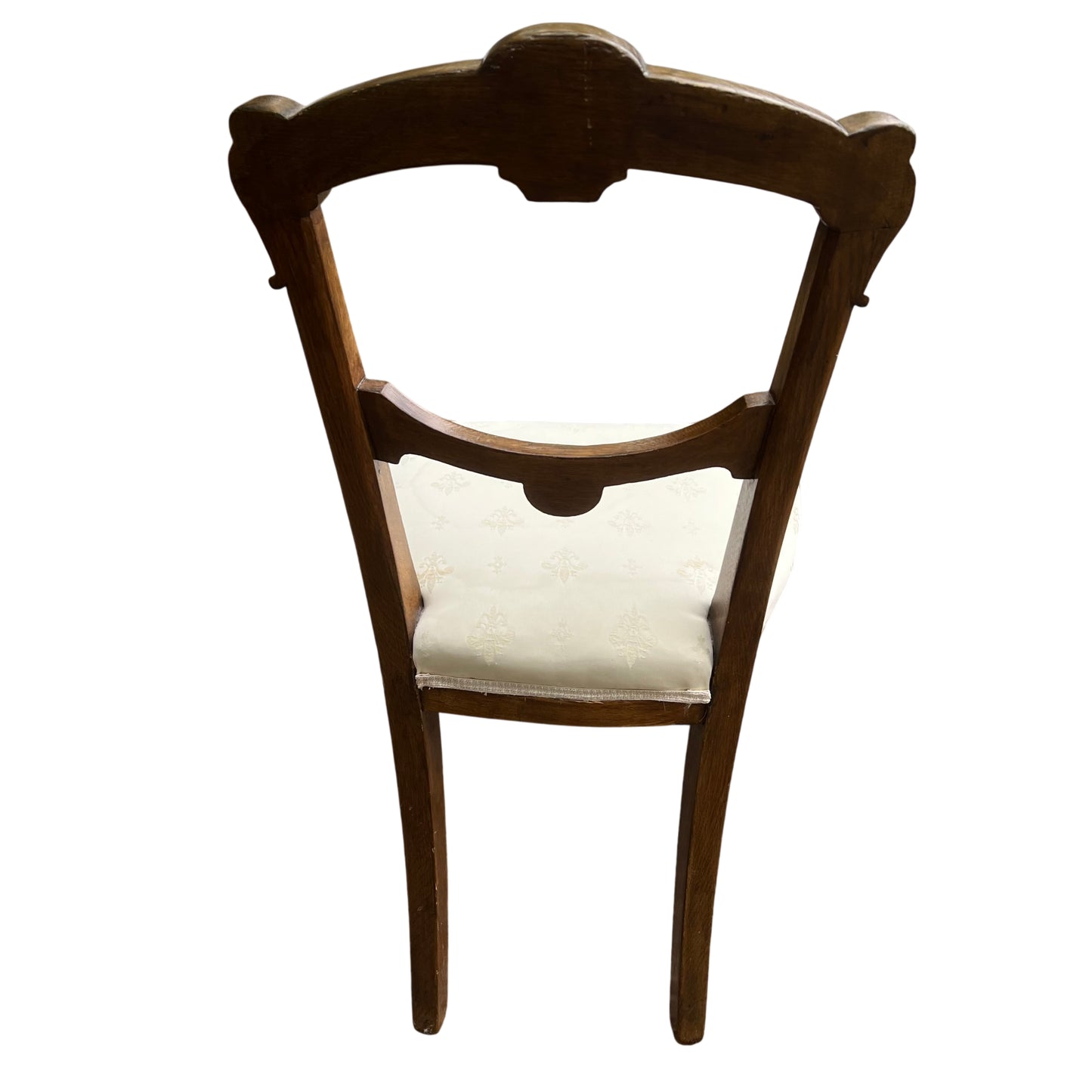Cream damask upholstered seat on a Victorian oak dining chair