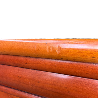 Top view of the cupboard showing smooth warm wood surface and rounded edge