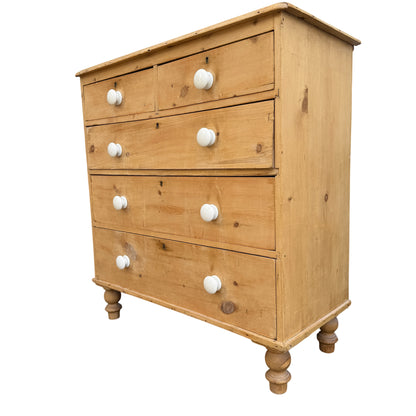 Victorian pine chest of drawers five-drawer tallboy with white ceramic knobs and turned bun feet