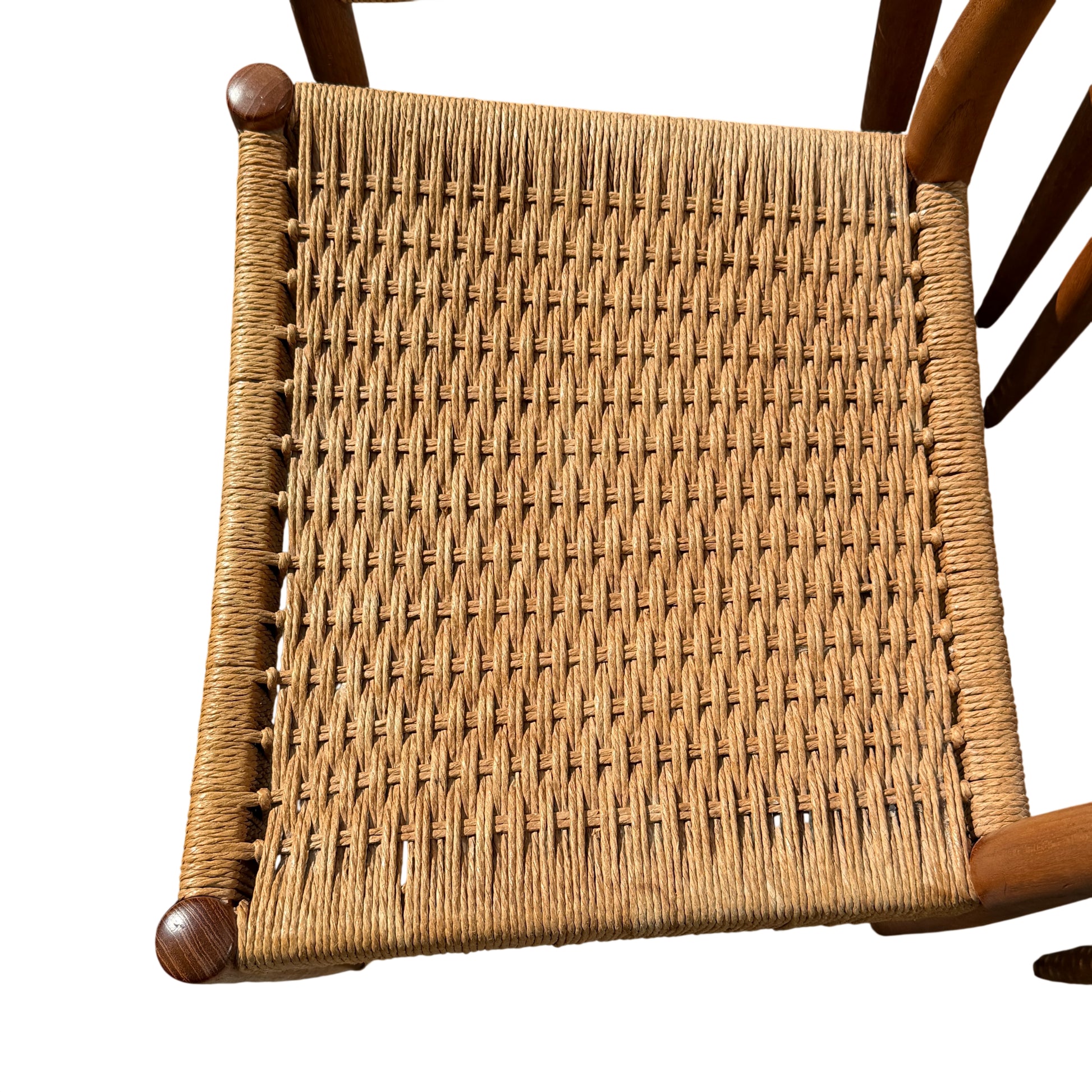 Side view of Mid Century dining chair showing tapered legs and swept back support