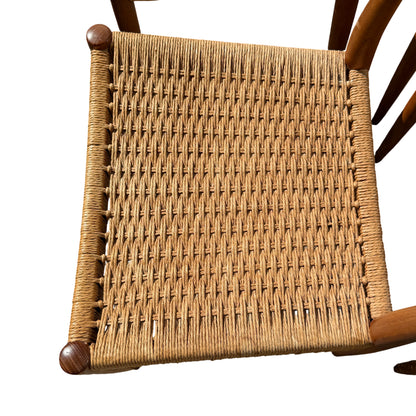 Side view of Mid Century dining chair showing tapered legs and swept back support