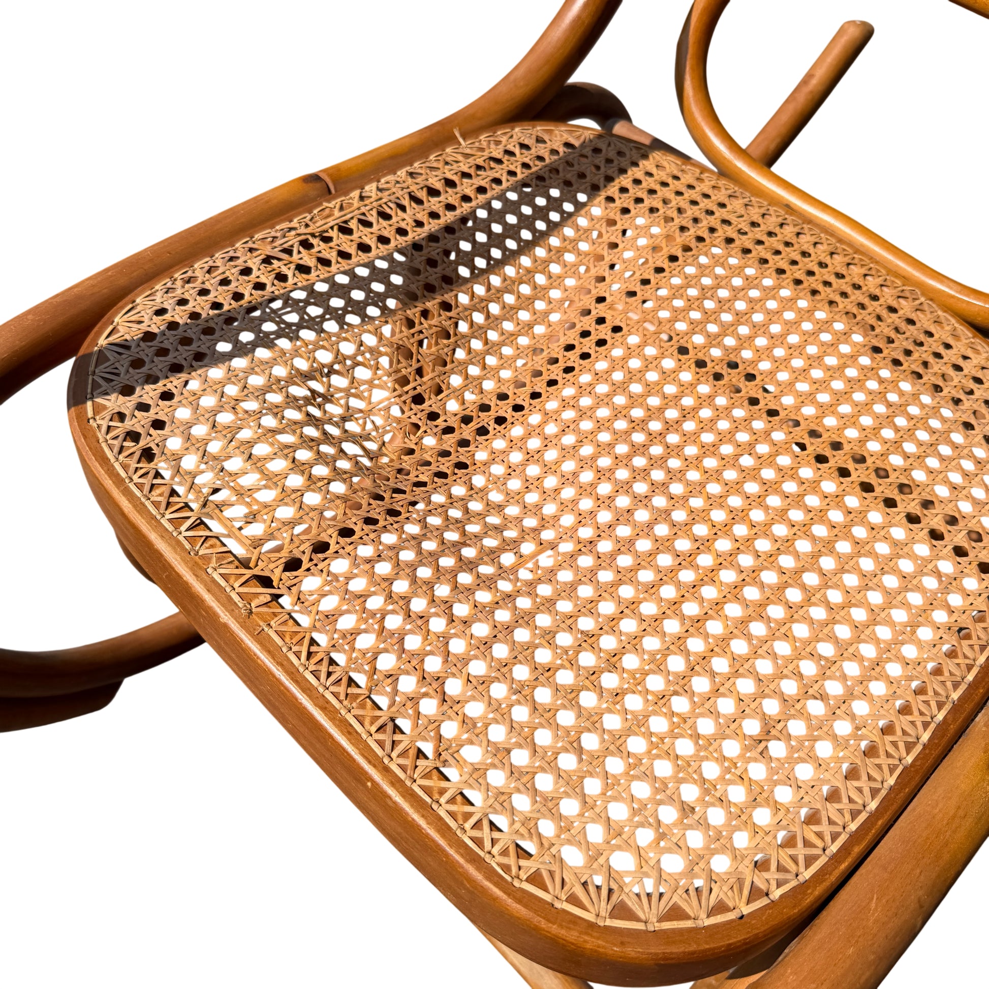 Top-down view of caned back on a vintage bentwood rocking chair