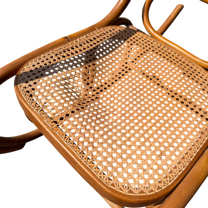 Top-down view of caned back on a vintage bentwood rocking chair