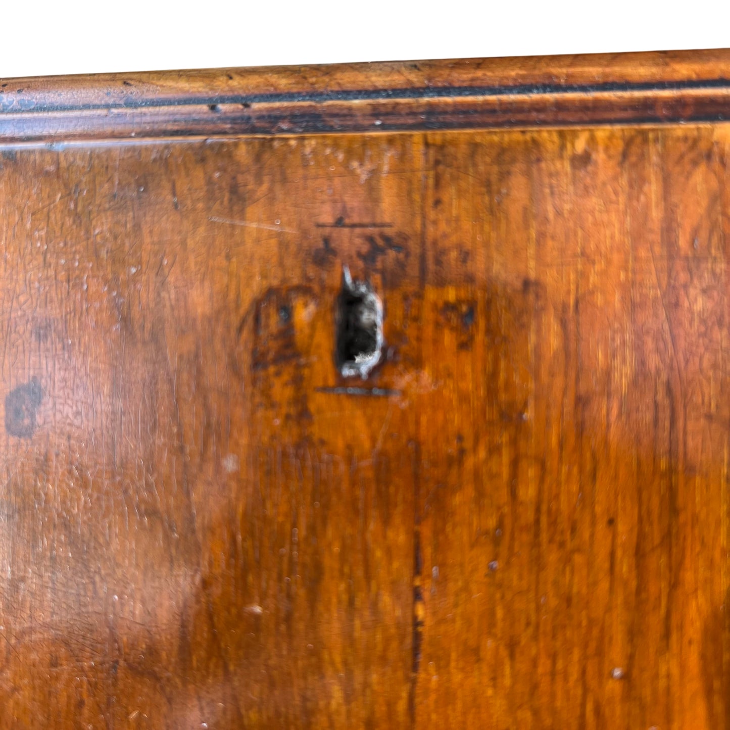 Brass drop handle close-up on Victorian oak chest drawer