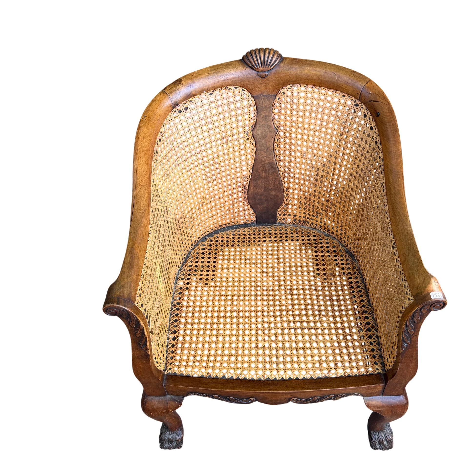 Close-up of woven cane seat rim and underside of upholstered cushion