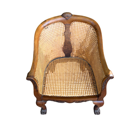 Close-up of woven cane seat rim and underside of upholstered cushion