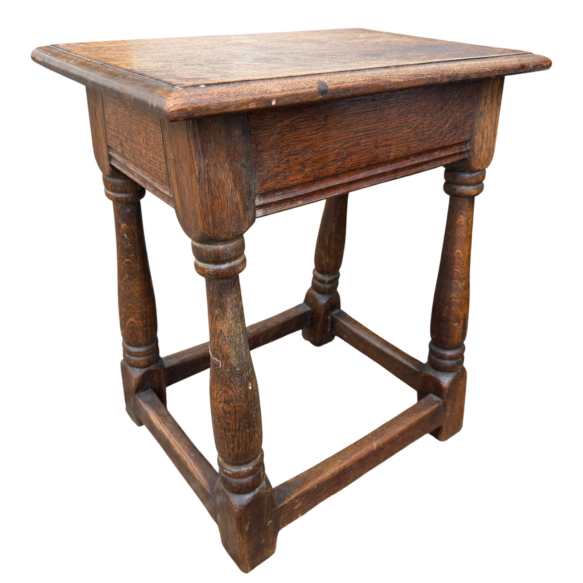Close-up of oak tabletop with visible grain and darker patch