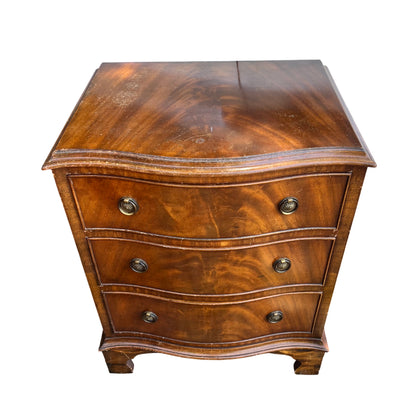 Top view of vintage mahogany bedside chest showing grain and moulded edge