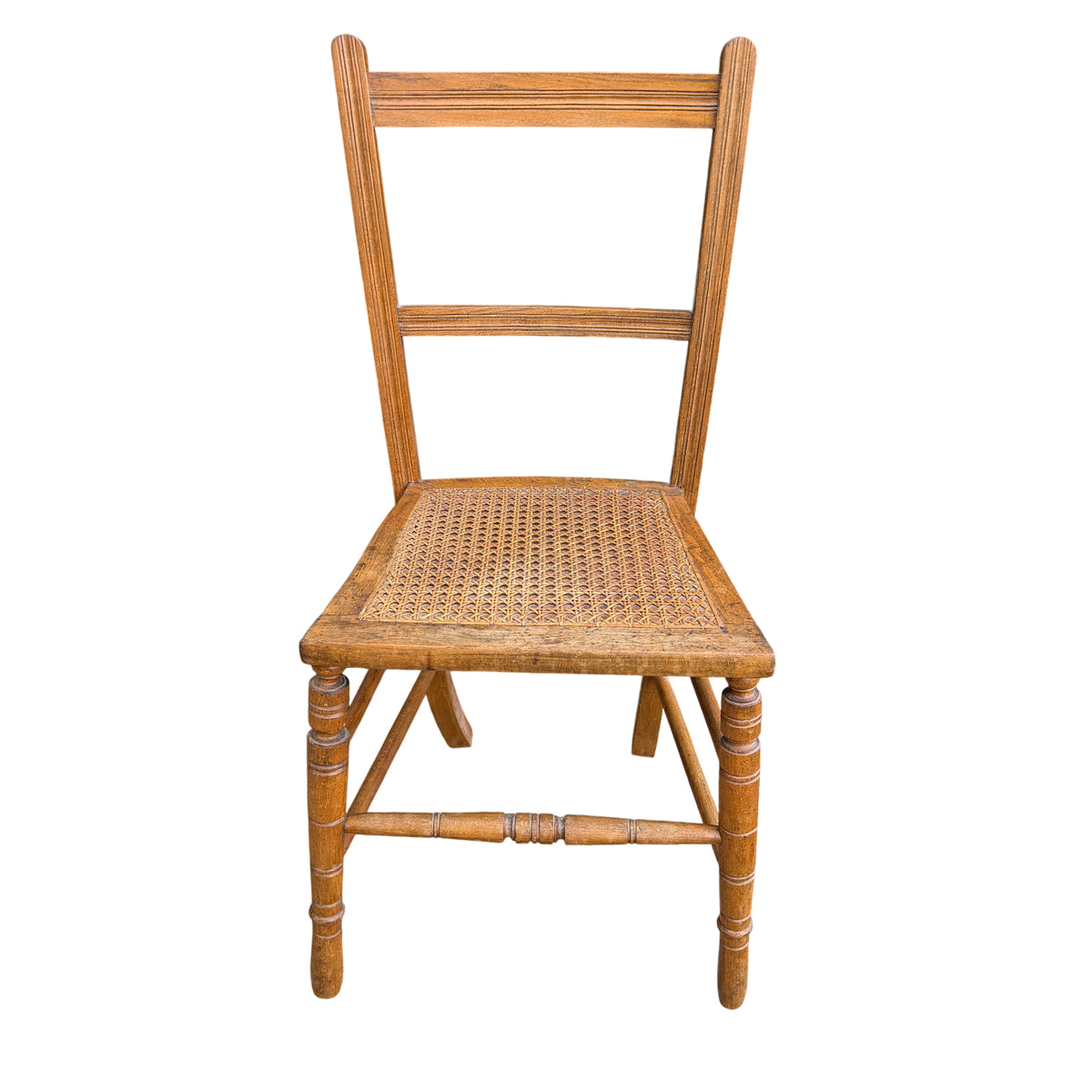 Front view ladderback dining chair with caned seat and turned legs