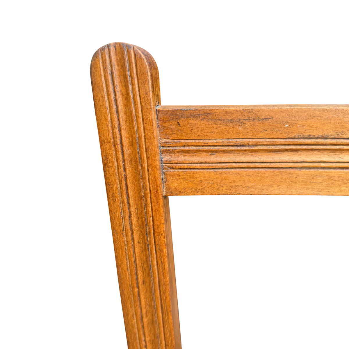 Top of ladderback chair showing two horizontal slats and wood grain