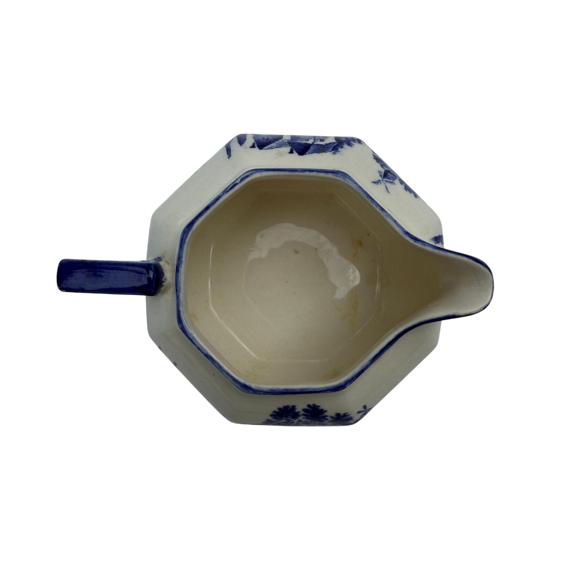 Octagonal Royal Doulton transferware milk jug in blue and white with pouring spout