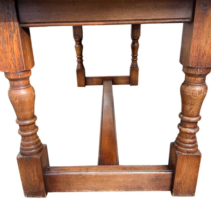 Turned oak leg and stretcher of Jacobean style dining table