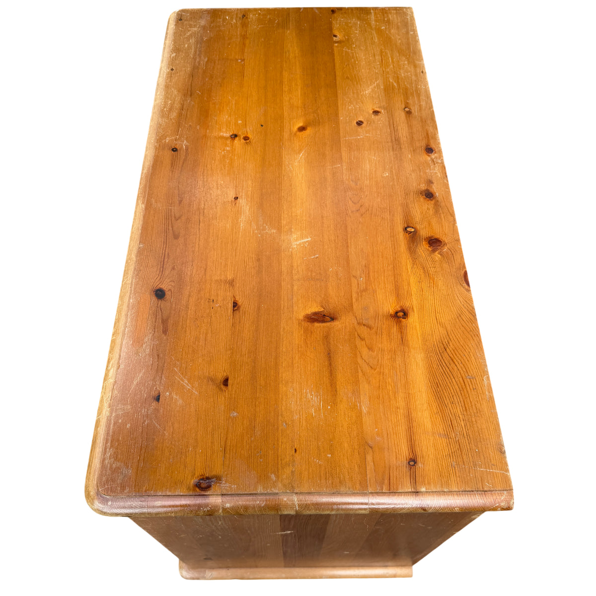 Rustic pine dresser showing natural wood grain and knots on drawer fronts