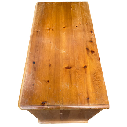 Rustic pine dresser showing natural wood grain and knots on drawer fronts