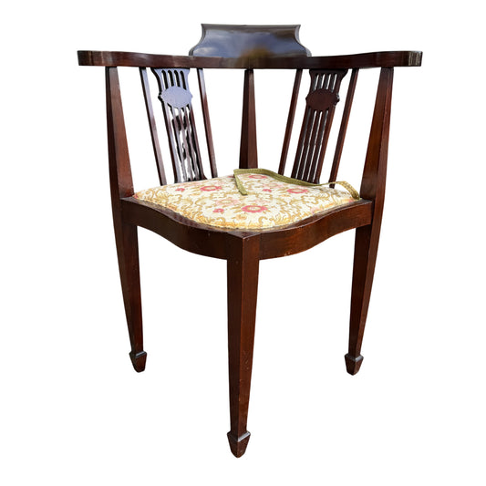 Edwardian mahogany corner chair with floral upholstered seat and spindle back