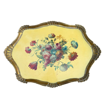 Close view of chipped gilt moulding and edge wear on vintage tray