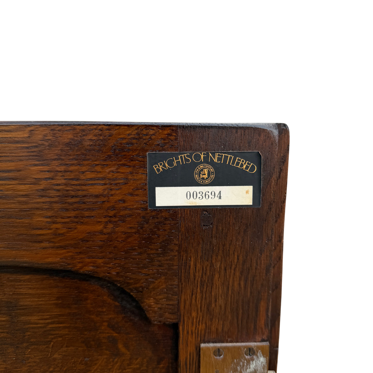 Turned front leg detail on vintage oak cabinet with plain rear legs