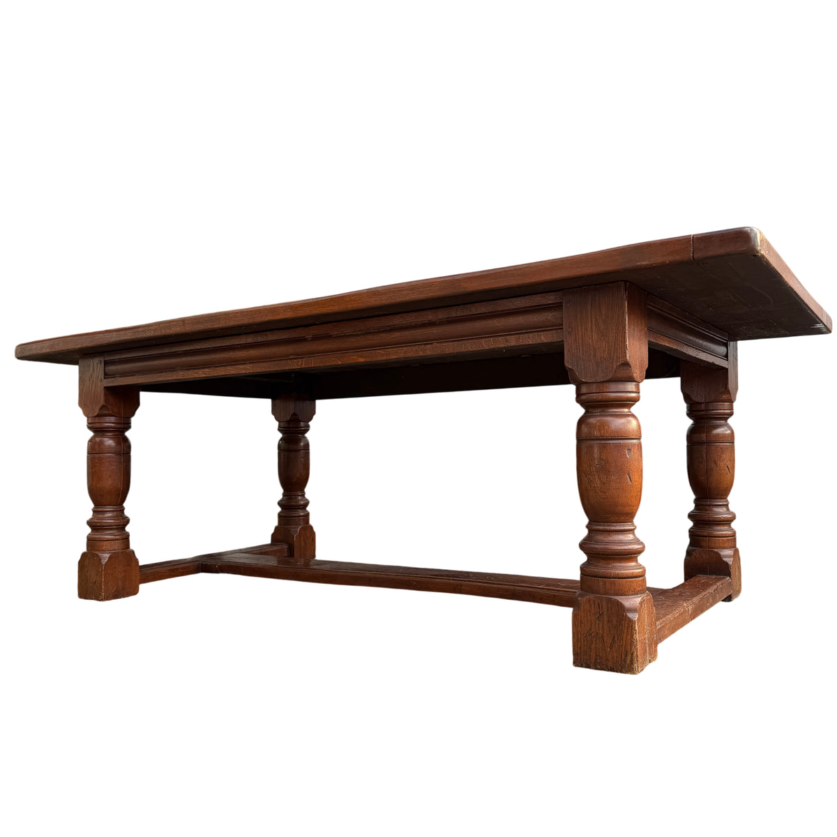 Heavy oak farmhouse trestle dining table with solid plank top and turned pedestal legs