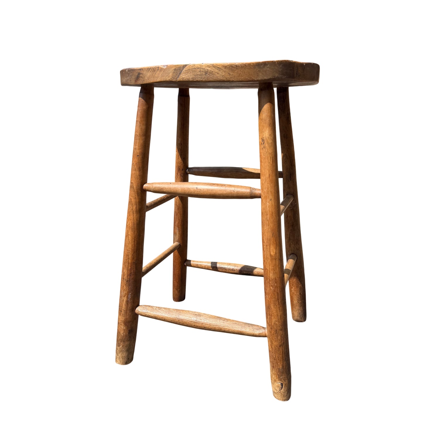 Top view of vintage wooden stool seat showing carry handle cut-out and surface scratches
