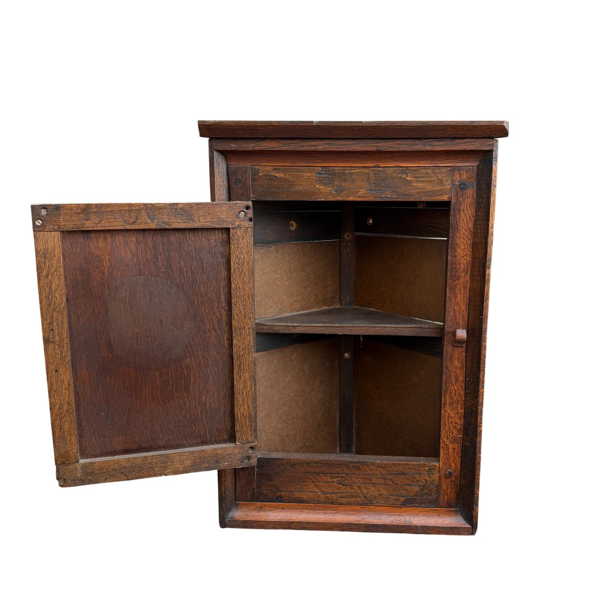 Brass hinge and oak frame of vintage corner wall cabinet