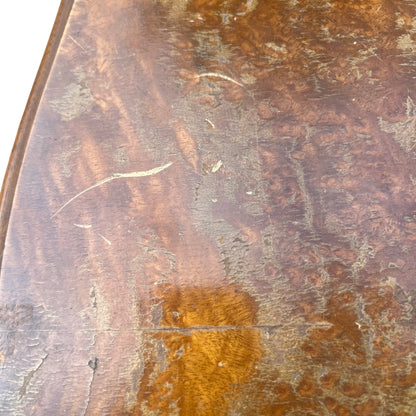 Shaped base and bracket feet of vintage walnut chest of drawers
