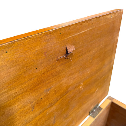 Side view of pine chest showing small split and scuffed finish