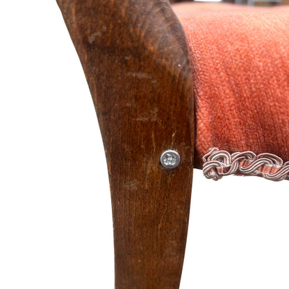 Detail of carved top rail and decorative carving on the back of the antique chair