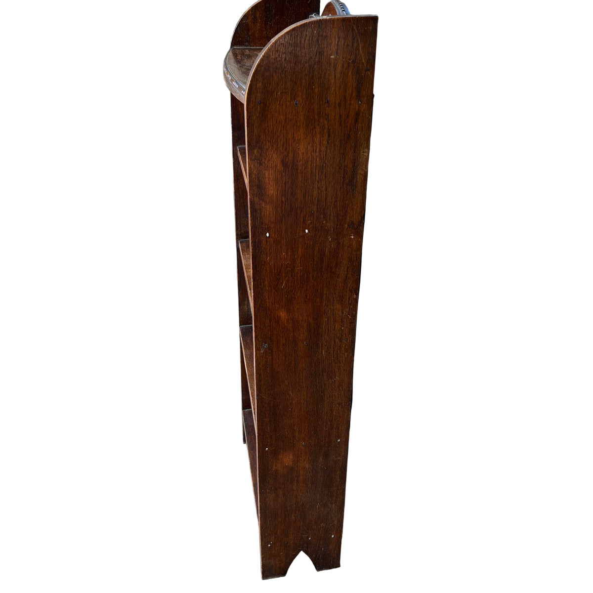 Close-up of moulded bead detailing to the top shelf edge on oak bookcase