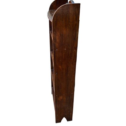 Close-up of moulded bead detailing to the top shelf edge on oak bookcase
