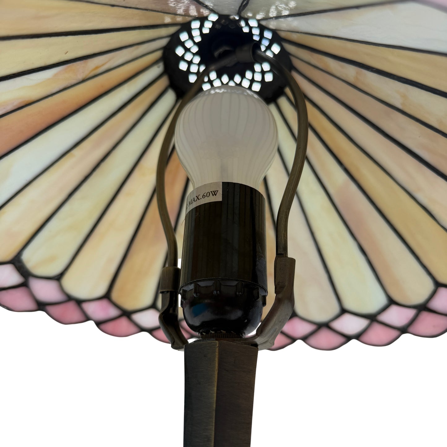 Side view of Tiffany-style lamp showing hexagonal brass-effect base and stem